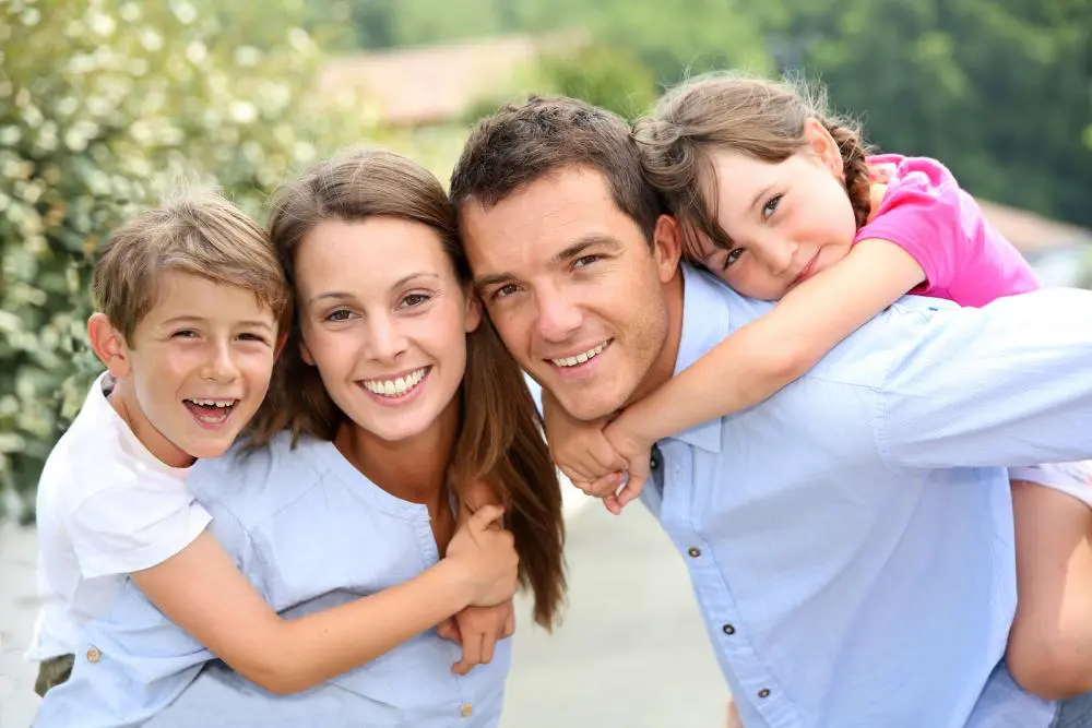 Family smiling about the family wellness services that their chiropractor provides.