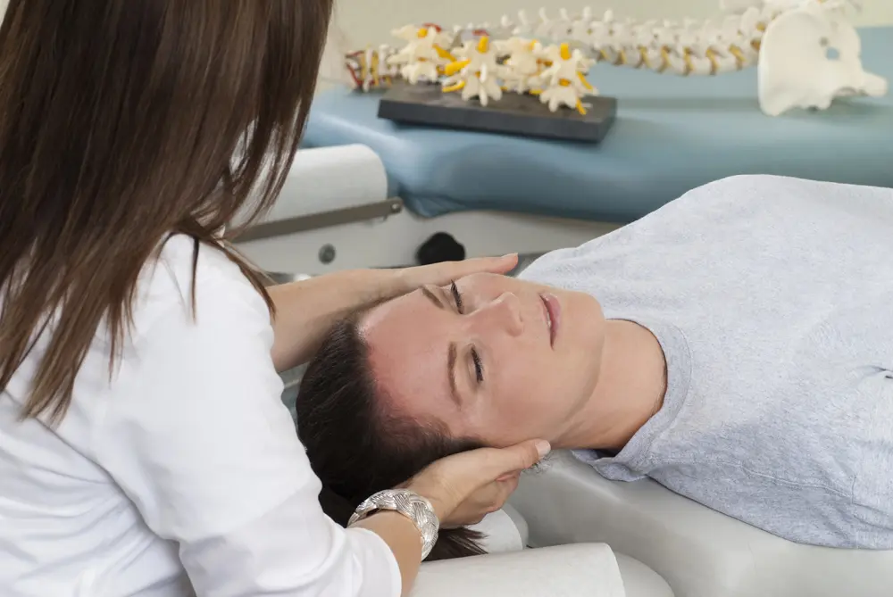 female patient getting neck pain treatment